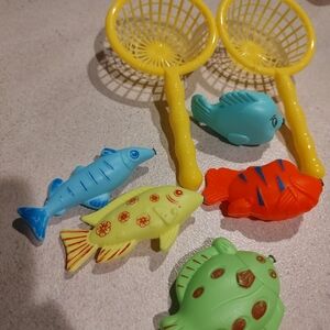 Lot of preschool toys includes 5 magnetic fish and two yellow nets. No rod